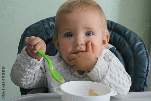 Сhild eats independently with spoon