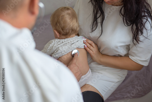 Pediatrician hold stethoscope exam baby. Children medical care