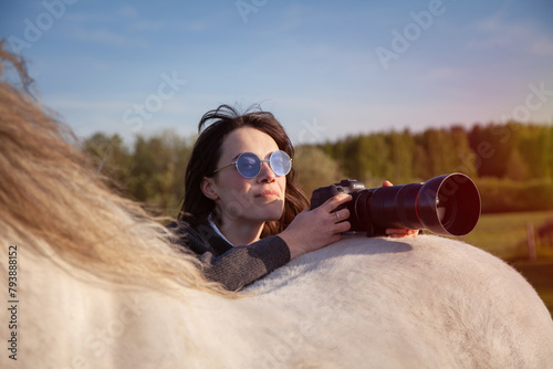 beautiful woman making pictures of horse