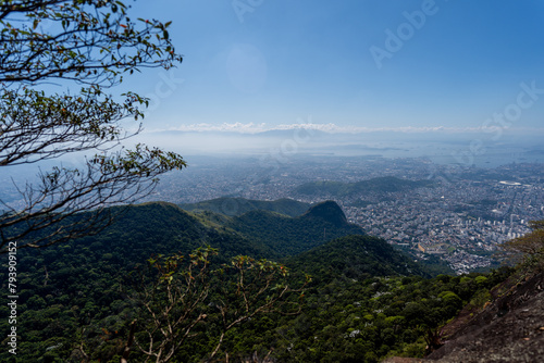 Incredible view of the wonderful city of Rio de Janeiro. Pico da Tijuca offers tourists and adventurers a beautiful panoramic view of the Tijuca forest, mountains, beaches and the city's buildings.