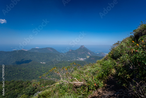 Incredible view of the wonderful city of Rio de Janeiro. Pico da Tijuca offers tourists and adventurers a beautiful panoramic view of the Tijuca forest, mountains, beaches and the city's buildings.