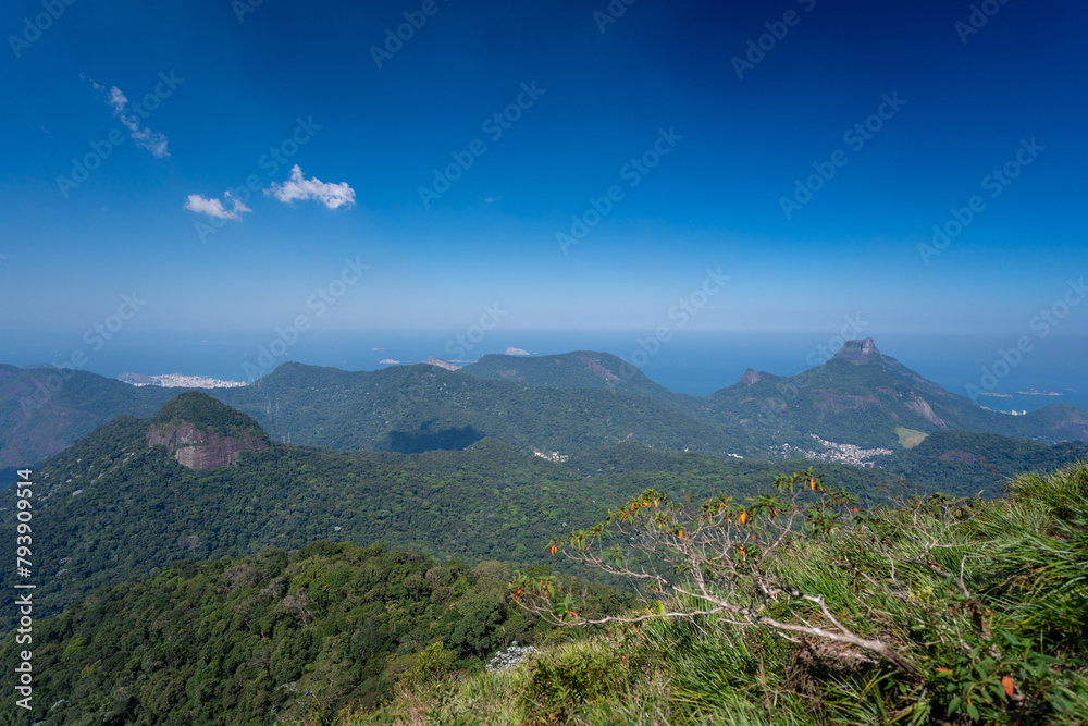 Incredible view of the wonderful city of Rio de Janeiro. Pico da Tijuca offers tourists and adventurers a beautiful panoramic view of the Tijuca forest, mountains, beaches and the city's buildings.