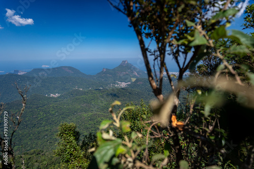 Incredible view of the wonderful city of Rio de Janeiro. Pico da Tijuca offers tourists and adventurers a beautiful panoramic view of the Tijuca forest, mountains, beaches and the city's buildings.