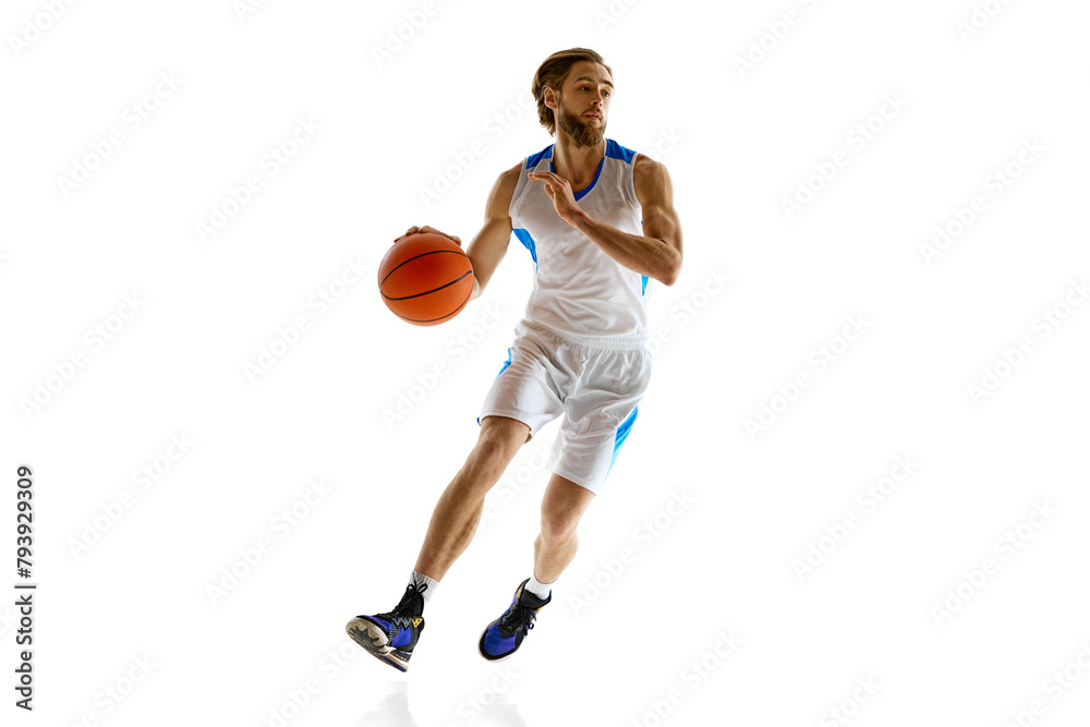 Competitive athlete practicing, basketball player in uniform in motion with ball isolated on white background. Concentration. Concept of sport, competition, active and healthy lifestyle, game