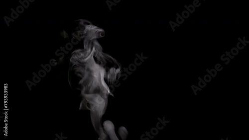Steam Rises From the Cup. White smoke on black background. Motion at a rate of 240 fps