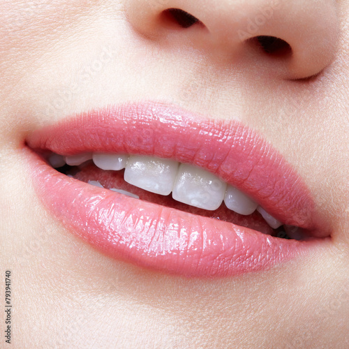 Close-up macro portrait of female part of face. Human woman lips with day beauty makeup
