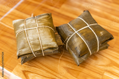 Two pairs of tamales on table, traditional Costa Rican food. 