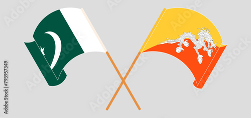 Crossed and waving flags of Pakistan and Bhutan