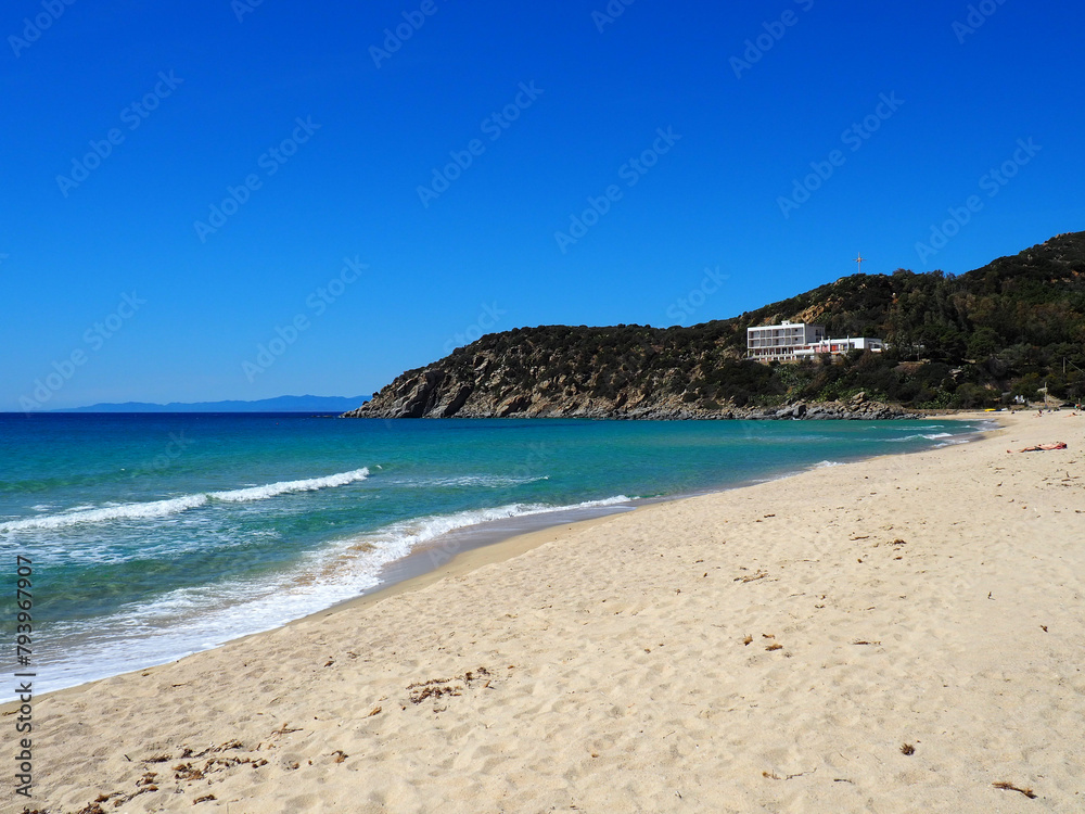 Beautiful solanas beach with turquoise water under blue sky and white sand.