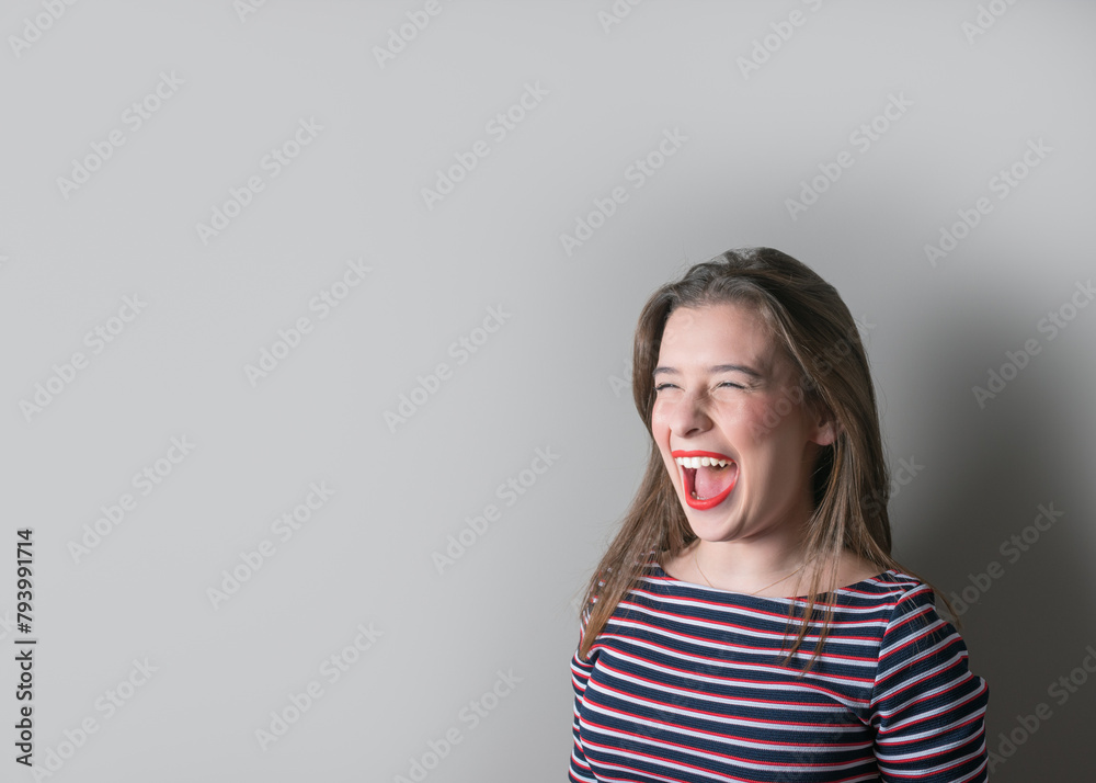 Screaming teenager girl in dress on bright background. Screaming teenager girl in dress on bright background.