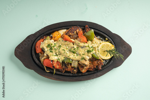 Chicken sizzler with Honey glazed chicken, mixed veg, cream cheese, cheese and mushroom sauce photo