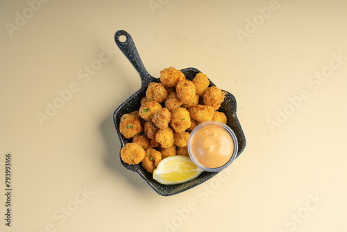 Crunchy chicken popcorn served with peri peri mayo sauce