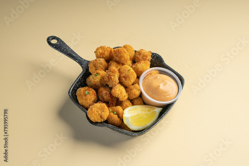 Crunchy chicken popcorn served with peri peri mayo sauce