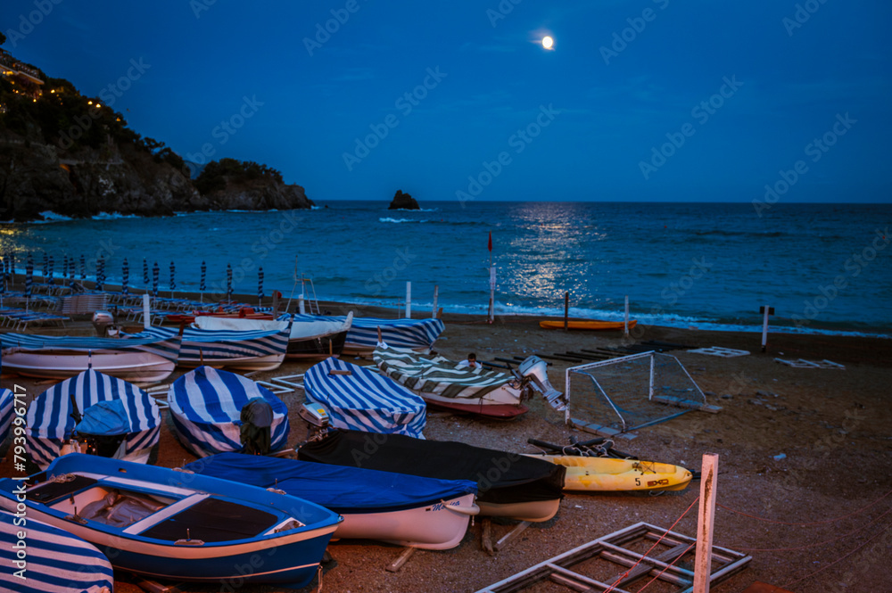 Magic of the Cinque Terre. Timeless images. Monterosso, the port, the beach and the ancient village at dusk