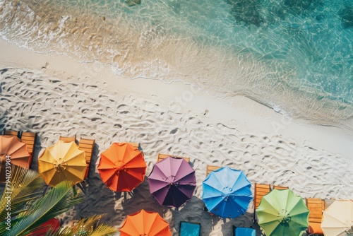 a row of colorful umbrellas and chairs on a beach
