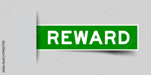 Green color square label sticker with word reward that inserted in gray background photo