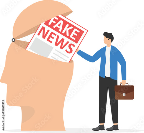 Fake news concept.Metaphor about contemporary media, people reading fake news, man adding fake news in big human head

