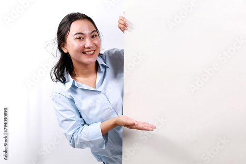 Portrait of young woman happy excited positive smile presenting empty space billboard ad advice choice isolated over white background