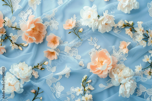 Soft peach and white blooms amidst intricate floral motifs on serene blue.