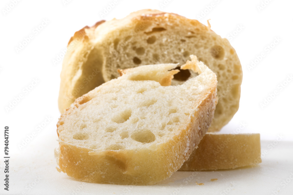 extreme closeup of French bread slices isolated on white extreme closeup of French bread slices isolated on white