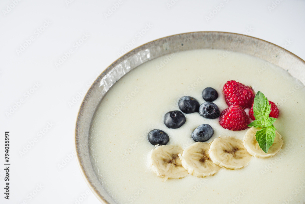 sweet semolina with berries on a white background sweet semolina with berries on a white background
