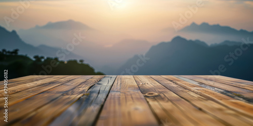 Rustic Wooden Table Overlooking a Misty Mountainous Landscape at Sunrise