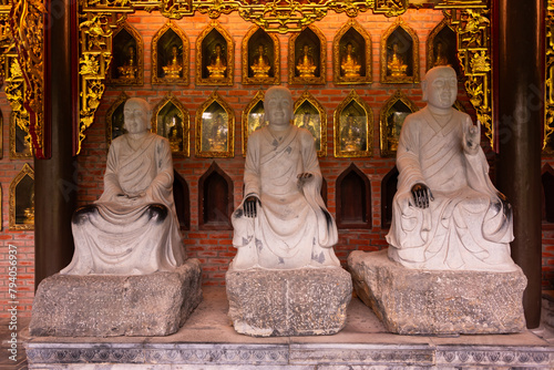 Many Buddha statues in a hindu temple in Vietnam