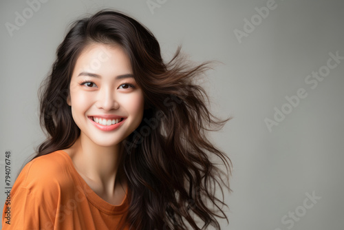Portrait of young biracial wasian or white asian woman with luscious hair