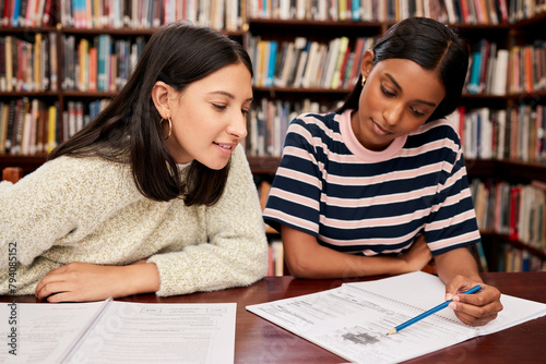 Education, students and women in library, university with project, tutor and knowledge with research, creative and brainstorming. Girls, college and friends with books, planning and talking with idea