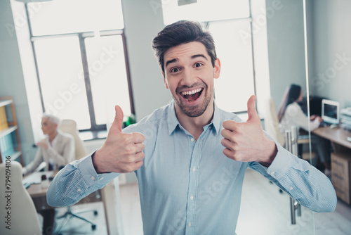 Photo of confident agent man make thumb up symbol advertise offer in office