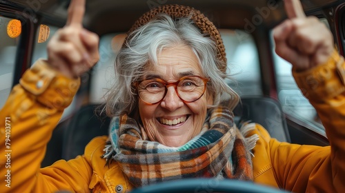 Happy elderly woman demonstrates driver