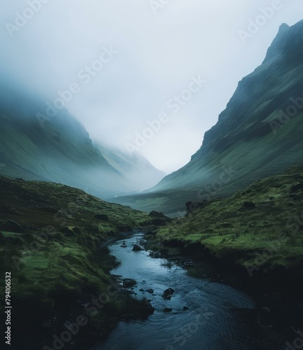 b'Misty mountains and a river flowing through a valley' photo