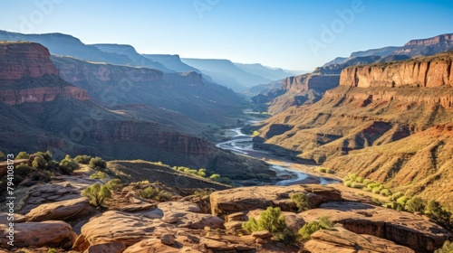 b'Arid desert canyon landscape with a winding river below'