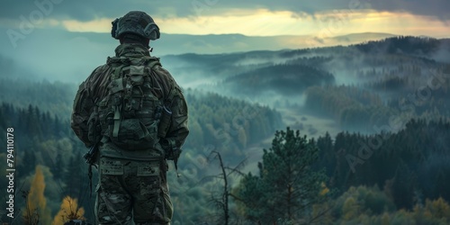 Soldier looking out over a forest photo