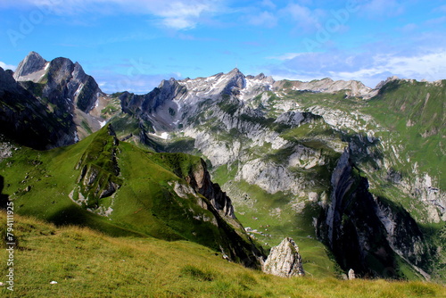 Dramatic Photo of Alpstein with clouds and shadow on the mountains, switzerland, hiking season  photo