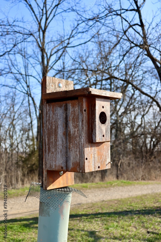 A close view of the old wood birdhouse.