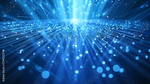 Abstract background. Abstract image depicting rays and particles of blue light emanating from a central point.