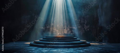 Dramatic stage with spotlight on circular steps in dark room