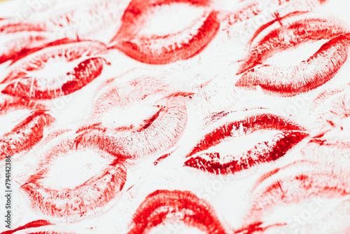 Imprint of red lips on white paper, kiss background