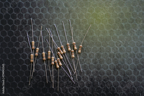 Resistors are electronic devices that control the amount of current and voltage between two points in a circuit. Soft and selective focus.