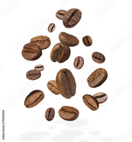 Roasted coffee beans falling on white background