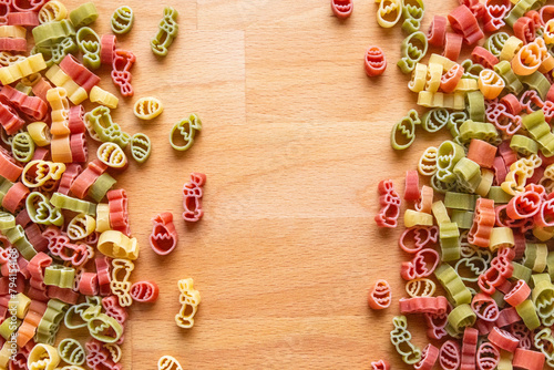 Colorful Easter pasta on a wooden cutting board