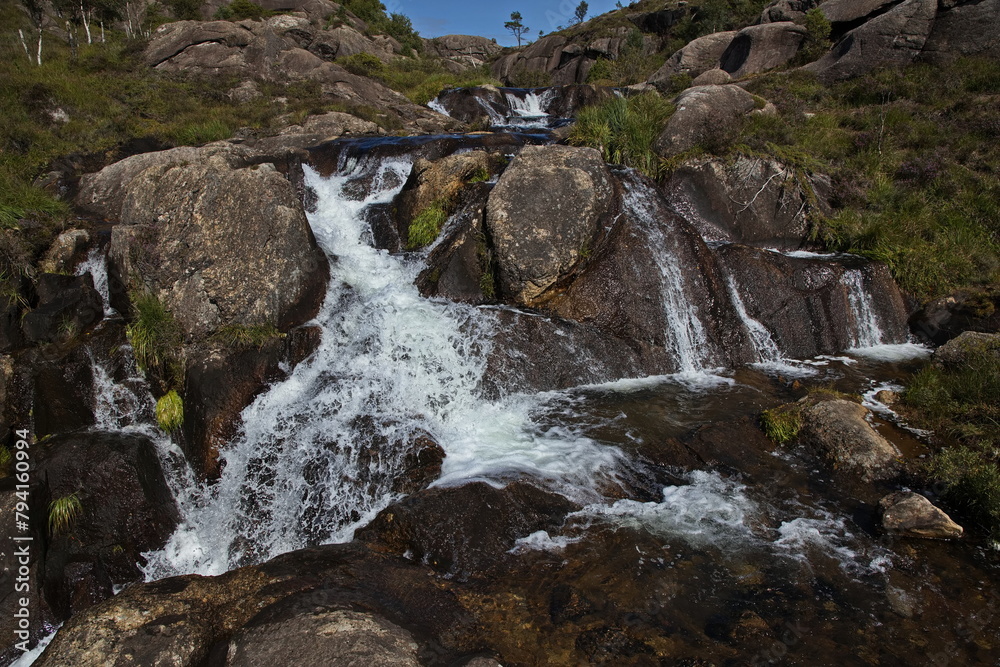 Obraz premium Waterfall at the hiking track to Trollpikken at Egersund in Norway, Europe 