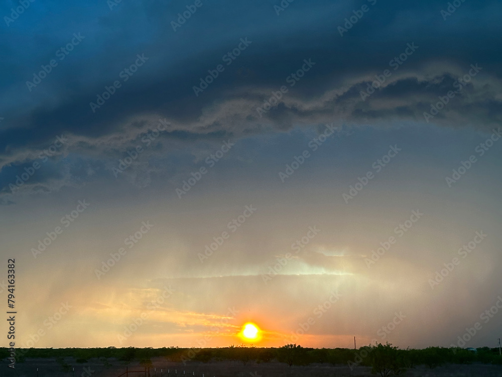 Obraz premium Sunset with Ominous Storm Clouds