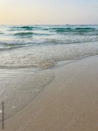Transparent sea water, natural sea surface background, sea water, sand bottom © Oksana