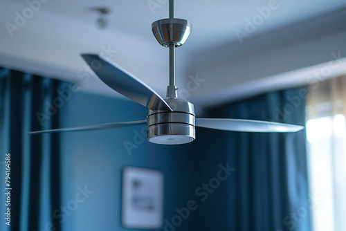 A ceiling fan incorporating the sleek, futuristic lines of mid-century modern design with blades tha photo