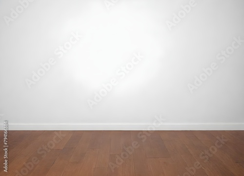 A wooden floor with a plain white wall in the background