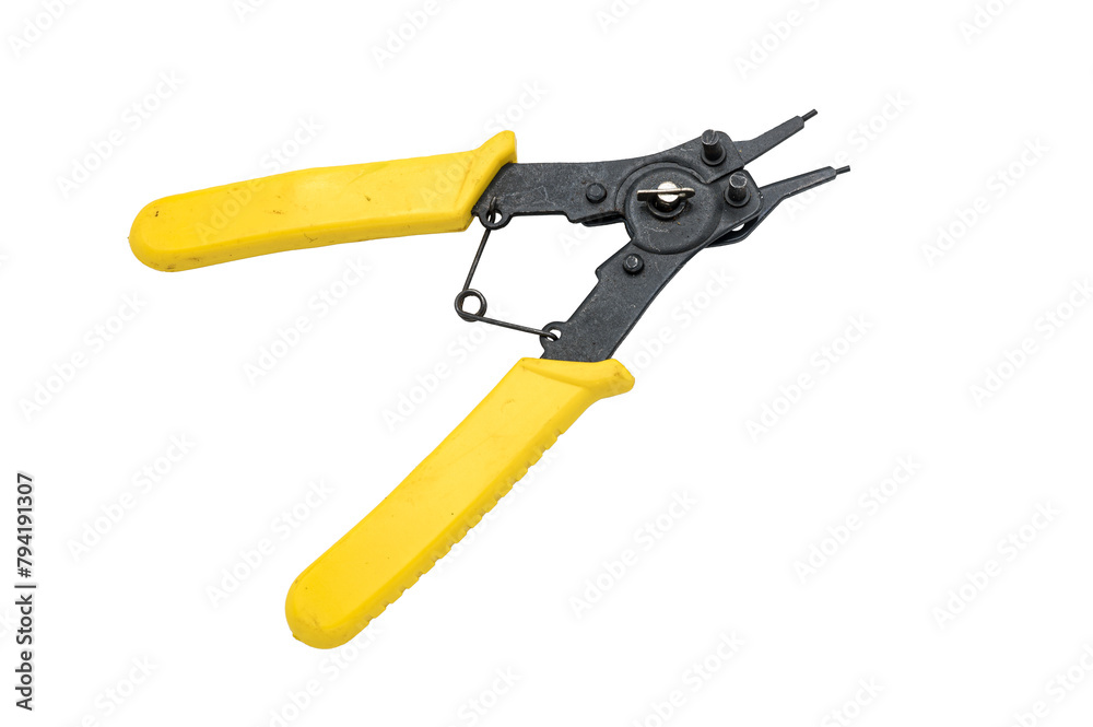 Detail of special pliers for circlip and retaining ring. Dual purpose for compression and extension. It has a yellow rubber handle and is a tool that is on a white background Detail of special pliers for circlip and retaining ring. Dual purpose for compression and extension. It has a yellow rubber handle and is a tool that is on a white background