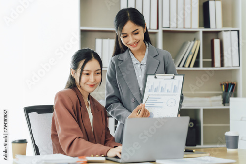 Entrepreneur Asian businesswoman discussing new business project in tablet in modern Meeting In Modern Office, Asian business casual concept.