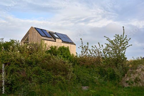 Environmentally friendly eco house with solar cells and photovoltaic. Sustainable vacation home in nature. Holland, Zeeland.
